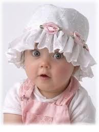 baby in pink with hat