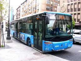 blue bus on streets in madrid