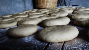 several breads ready to be baked