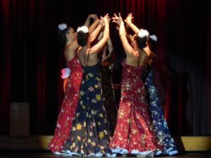 four colourful female flamenco dancers