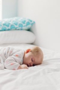 baby sleeping on belly