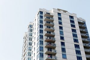 whhite apartment building with balconies