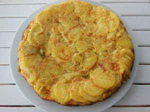 potatoe and onion tortilla on plate