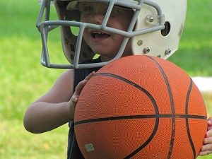 little boy playing basketball