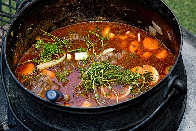 large pan with stew and herbs