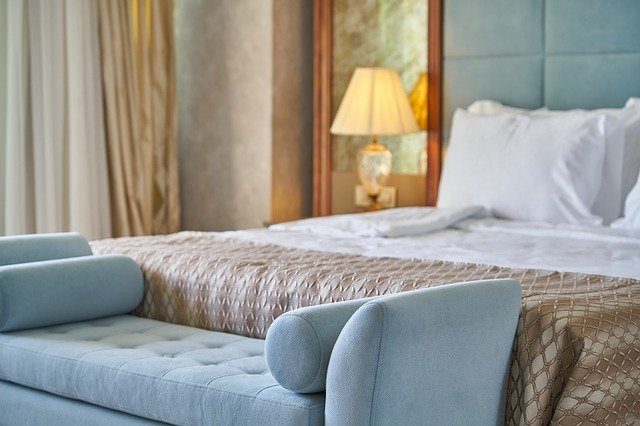 bedroom in light blue and soft browns