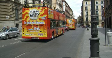 red, double decker tour bus in madrid