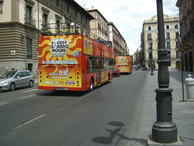 red, double decker tour bus in madrid