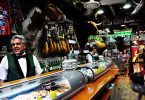 inside a bar with a waiter