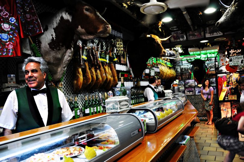 inside a bar with a waiter