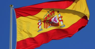 spanish flag with blue sky