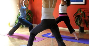 group doing yoga inside