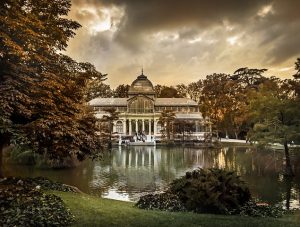 lake at buen retiro park in madrid with clouds