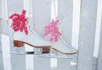ice skates on fence