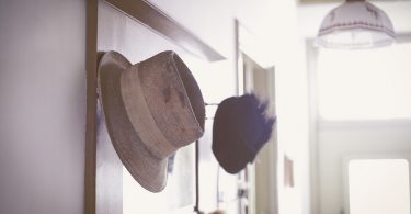 vintage hat and mirror in hallway