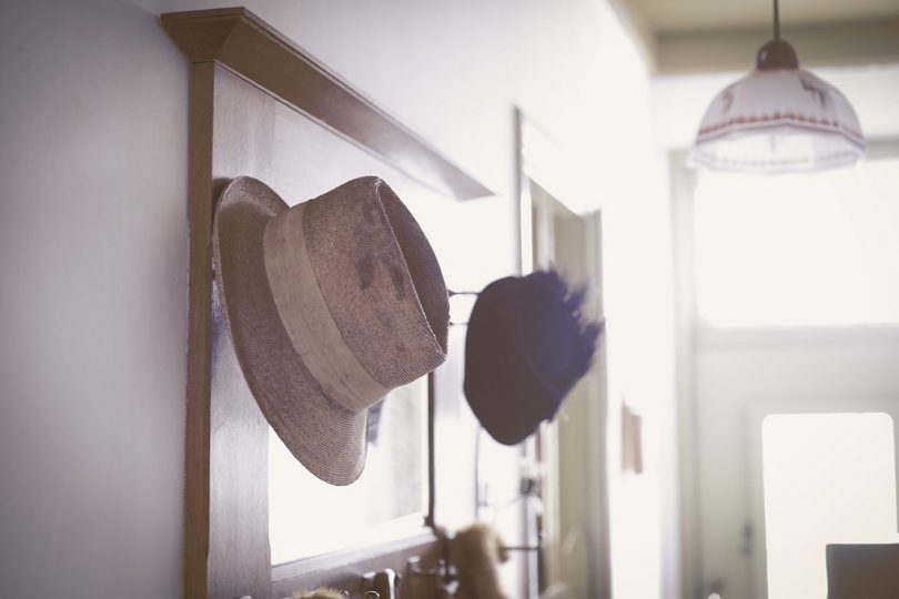 vintage hat and mirror in hallway