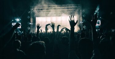 hands in the air from audience at concert