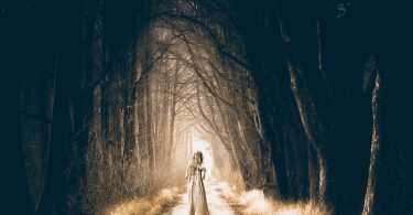 girl in dark forest