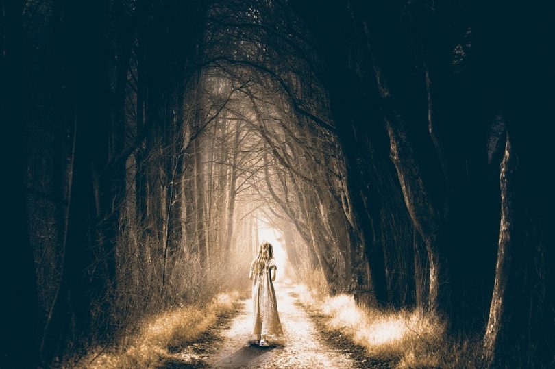 girl in dark forest