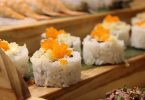 sushi with fish roe on wooden plate