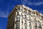 spanish building, light coloured with small balconies