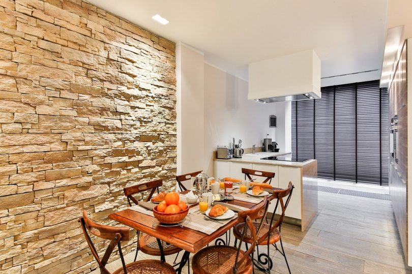 light kitchen with dining room in apartment