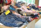 piles of second-hand clothes laid