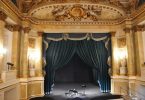 old theatre interior with blue curtain