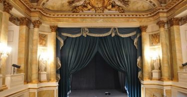 old theatre interior with blue curtain