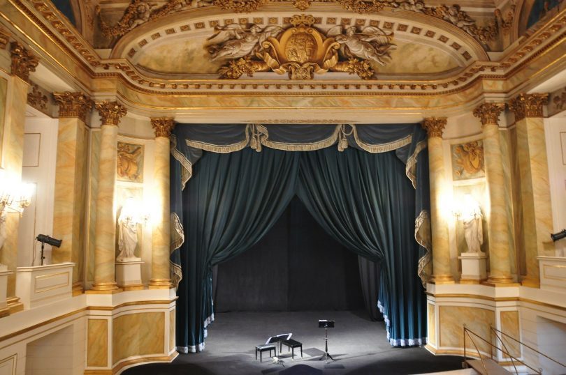old theatre interior with blue curtain