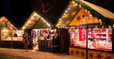 Christmas market stalls in dark