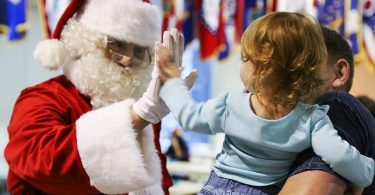 santa claus high fives child