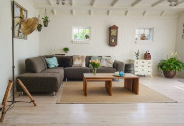 living room with brown couch and wooden tables