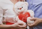 couple with teddy bear and red heart